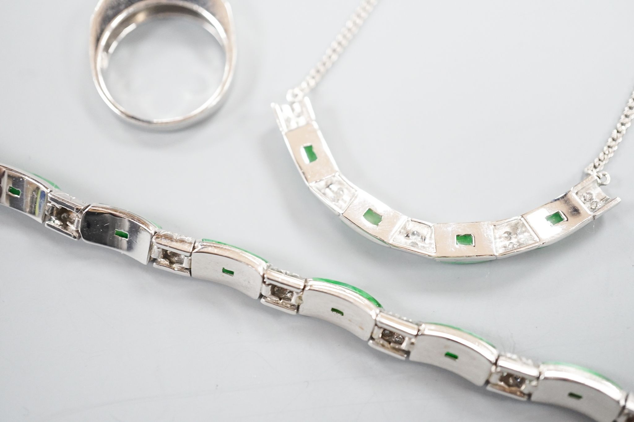 A modern white metal (stamped 850), jade and diamond cluster set bracelet, approx. 15.5cm, with a matching ring, size O and necklace, 38cm